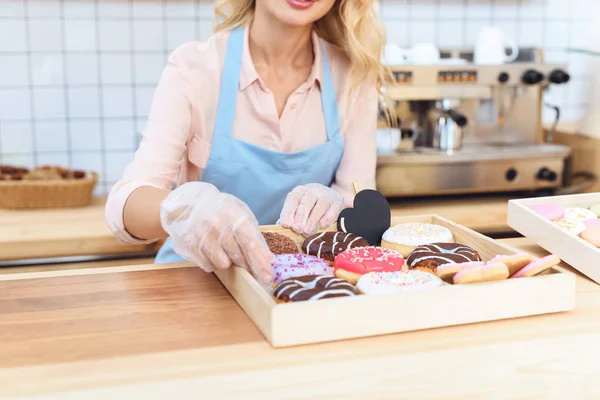 Waitress with cookies — Stock Photo