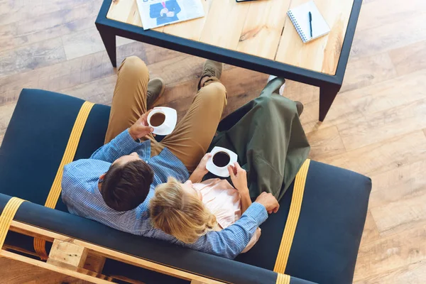 Couple drinking coffee in cafe — Stock Photo