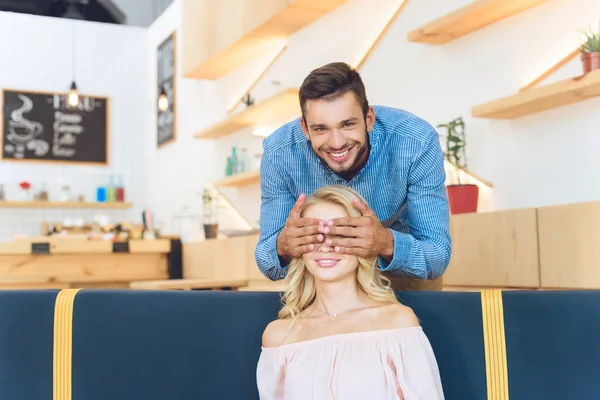 Happy young couple in cafe — Stock Photo