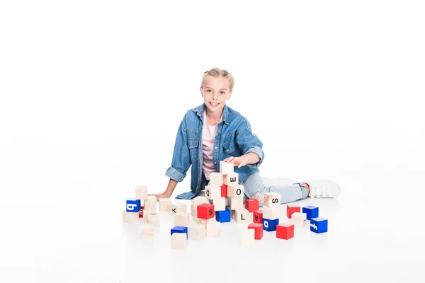 Kid with aphabet blocks — Stock Photo
