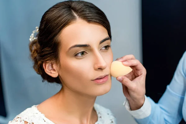 Woman getting makeup done — Stock Photo