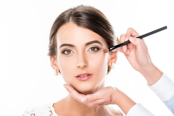 Makeup artist applying concealer — Stock Photo