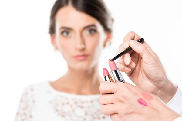 Lipsticks and lip brush — Stock Photo