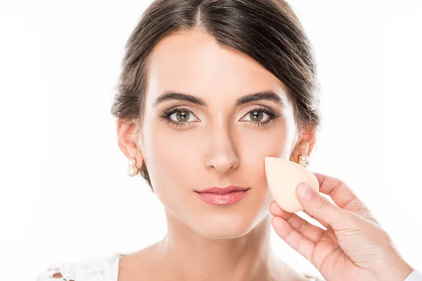Makeup artist applying foundation on face — Stock Photo