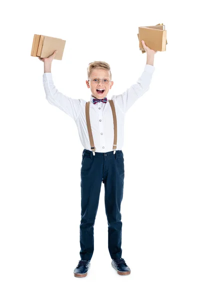 Niño sosteniendo libros - foto de stock