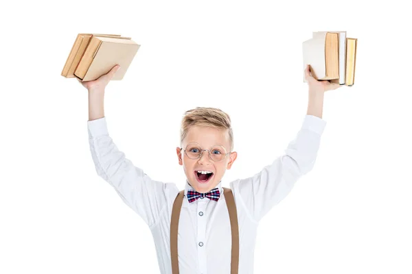 Niño sosteniendo libros - foto de stock