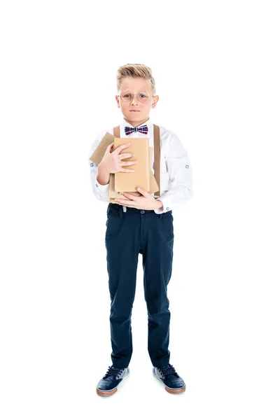 Niño sosteniendo libros - foto de stock