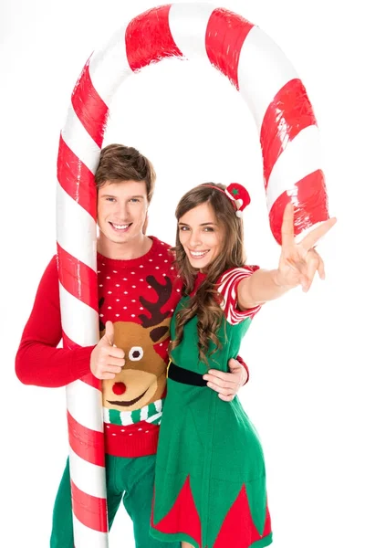 Casal com pirulito decorativo de Natal — Fotografia de Stock