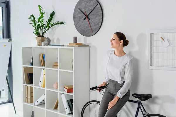 Businesswoman sitting in office — Stock Photo