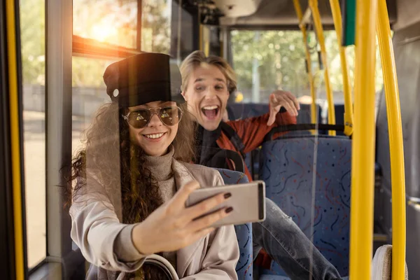 Couple taking selfie in public transport — Stock Photo