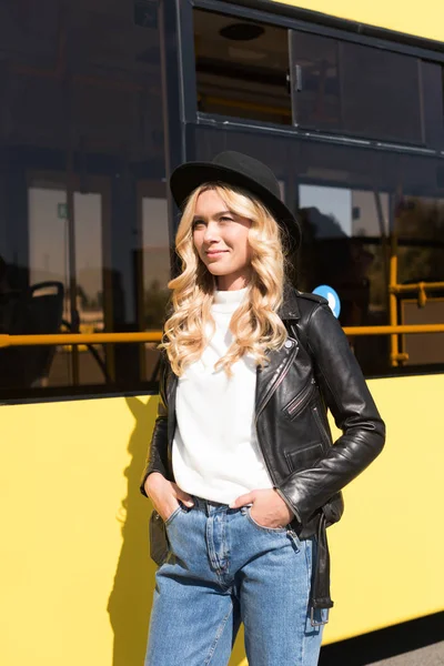 Woman standing near city bus — Stock Photo