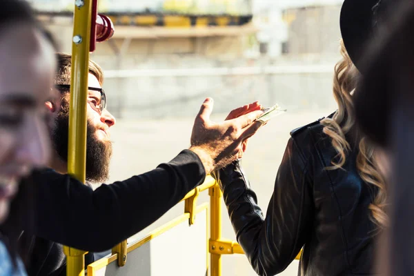 Man passing ticket in bus — Stock Photo