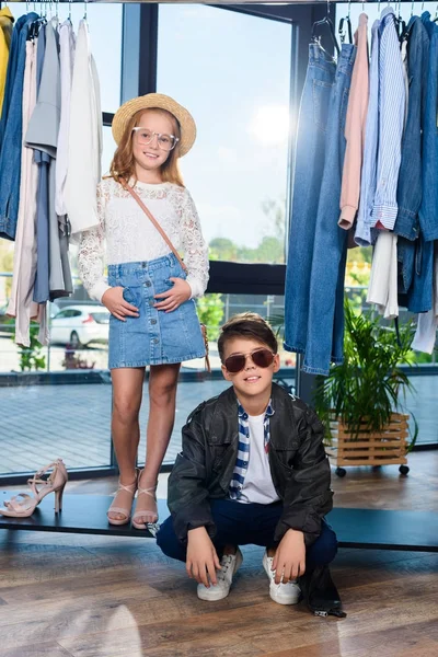 Little stylish couple in boutique — Stock Photo