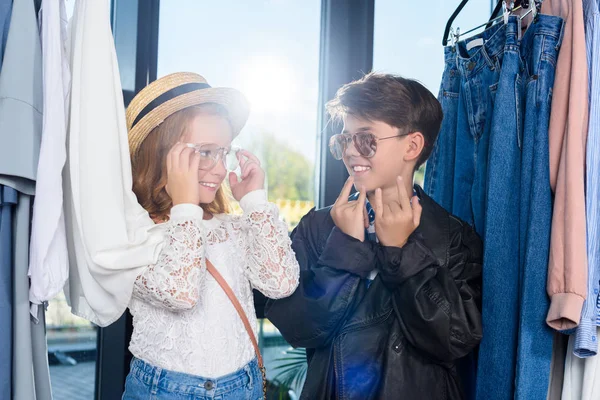 Little stylish couple in boutique — Stock Photo