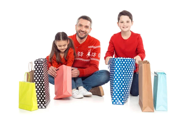 Family with shopping bags — Stock Photo