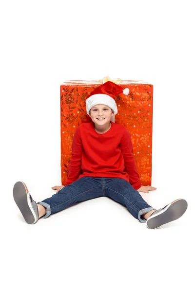 Boy with big christmas present — Stock Photo