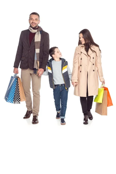 Padres e hijo con bolsas de compras - foto de stock