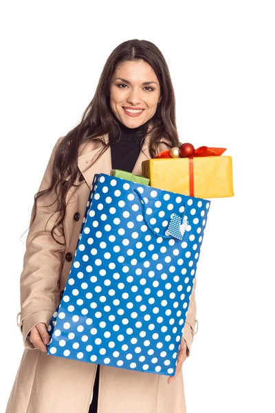 Woman with shopping bag and gifts — Stock Photo