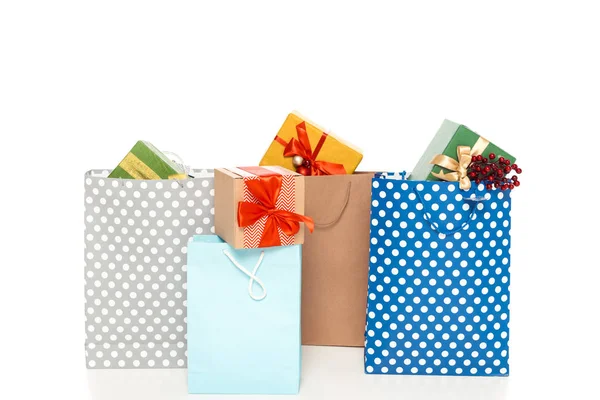 Shopping bags with gifts — Stock Photo