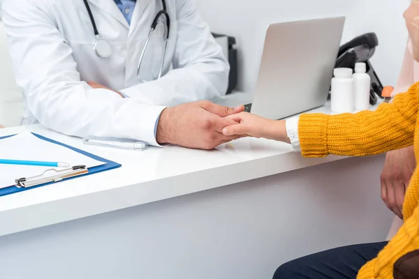 Girl shaking hands with doctor — Stock Photo