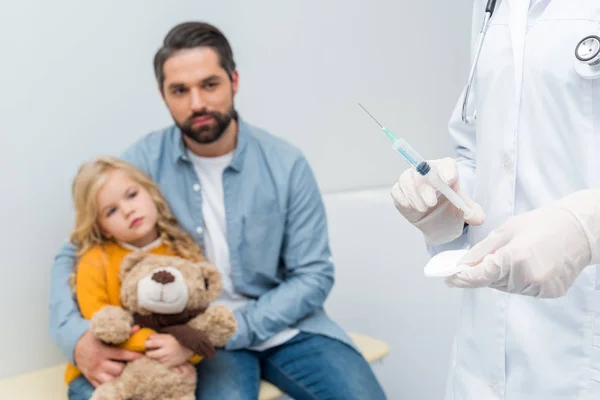 Female doctor with syringe — Stock Photo