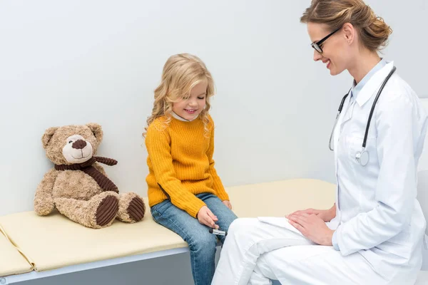 Girl doing neurology examination for doctor — Stock Photo