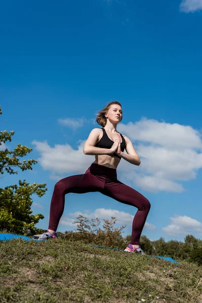 Woman in buddhist stupa pose — Stock Photo