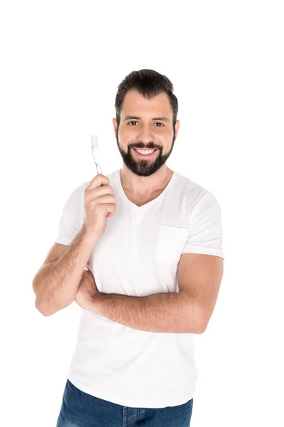Hombre sonriente con cepillo de dientes - foto de stock
