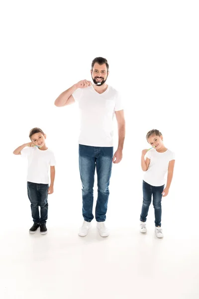 Family brushing teeth — Stock Photo