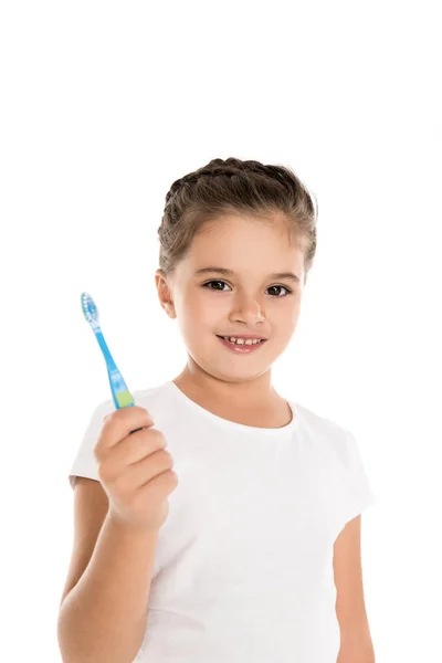 Ребенок держит зубную щетку — стоковое фото
