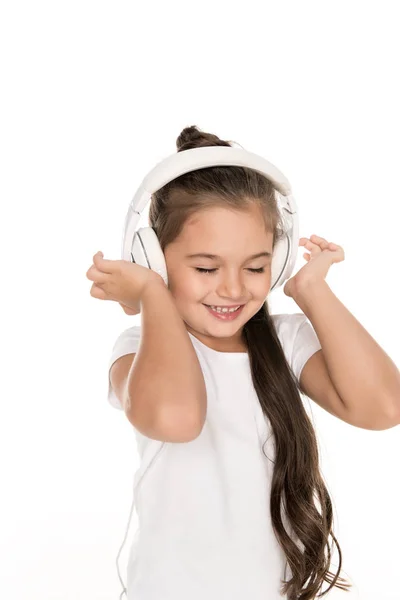 Criança sorridente em fones de ouvido — Fotografia de Stock