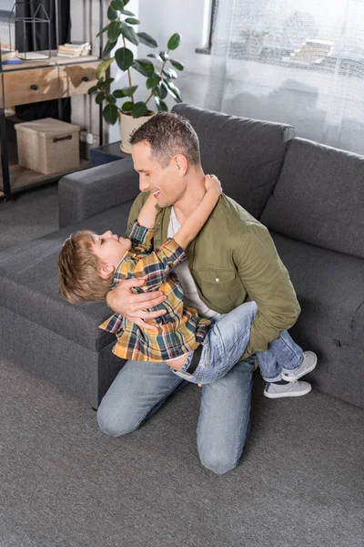 Father and son playing at home — Stock Photo