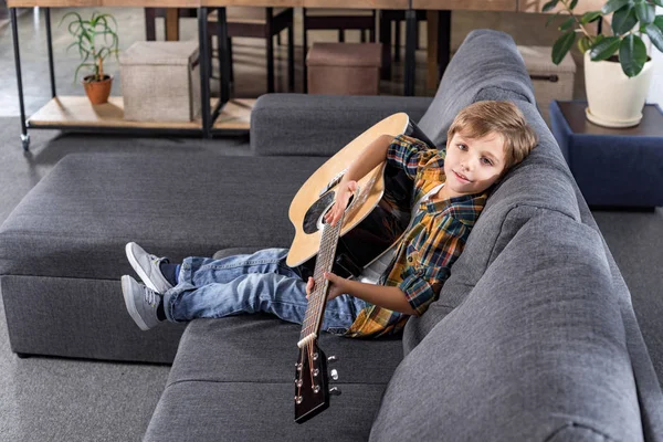 Little boy with acoustic guitar — Stock Photo