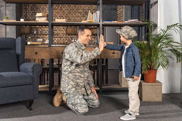 Father giving high five to son — Stock Photo