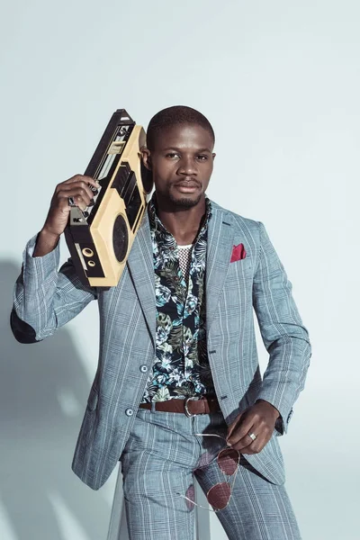 Stylish man holding boombox — Stock Photo