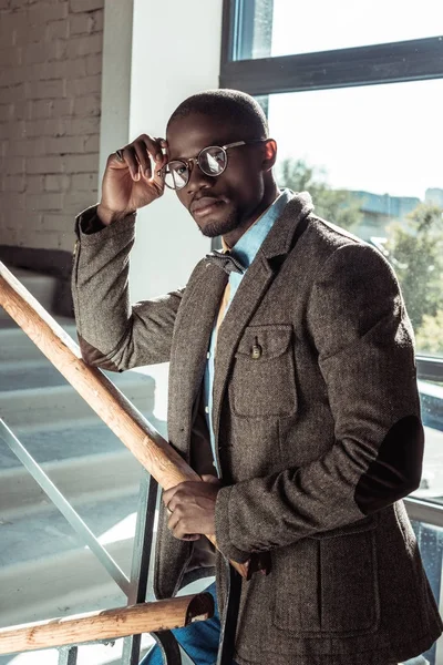Stylish african american man on stairs — Stock Photo
