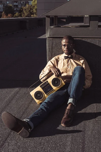 Man on floor with boombox — Stock Photo