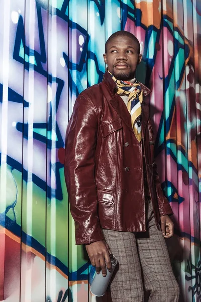 African american man holding can of paint — Stock Photo