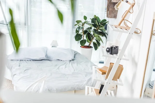 Bed in cozy bedroom — Stock Photo