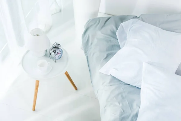 Alarm clock in bedroom — Stock Photo