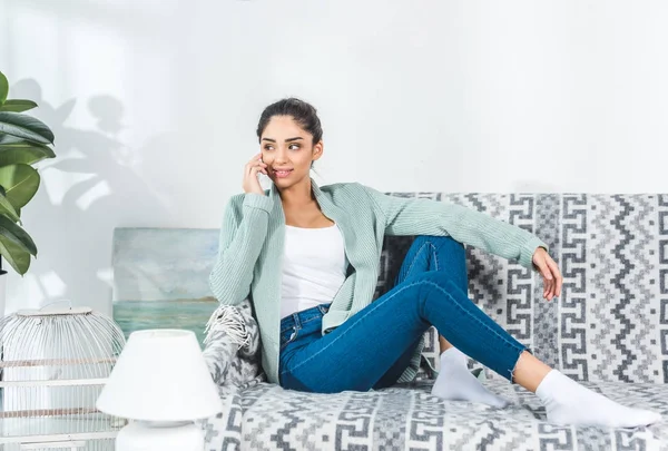 Girl using smartphone at home — Stock Photo