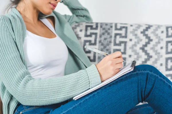 Girl with notebook at home — Stock Photo