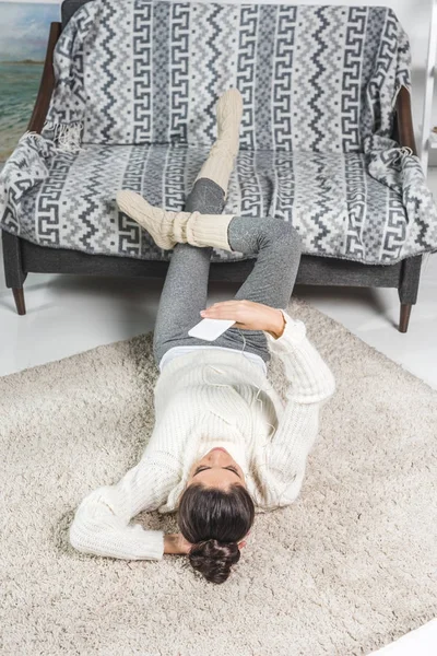 Girl using smartphone at home — Stock Photo