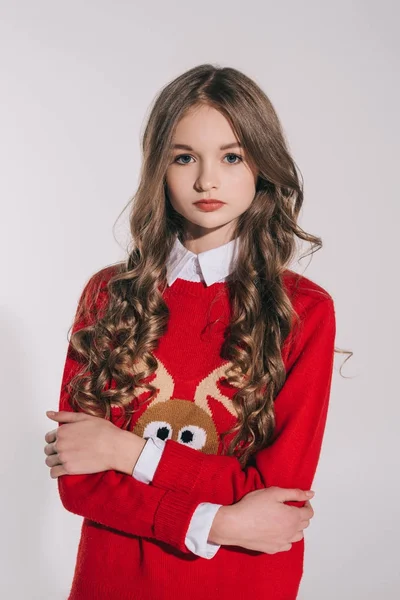 Girl in red sweater with reindeer — Stock Photo