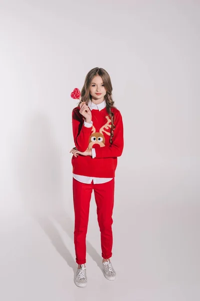 Teenage girl holding candy — Stock Photo