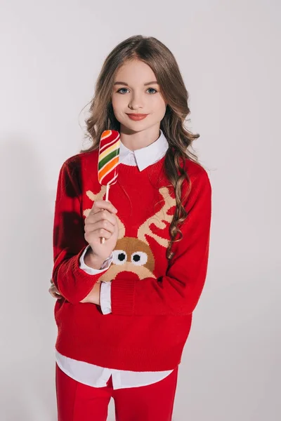 Teenage girl holding candy — Stock Photo