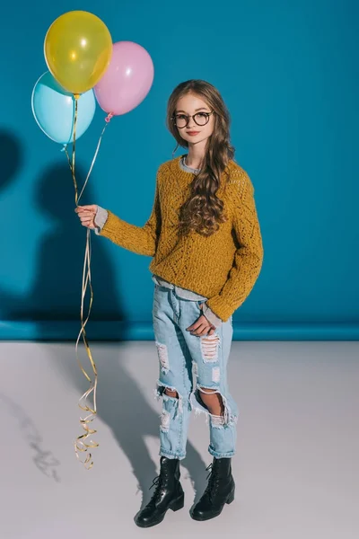 Stylish teenage girl with balloons — Stock Photo
