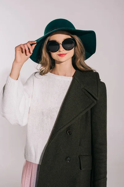 Teenage girl in hat and overcoat — Stock Photo