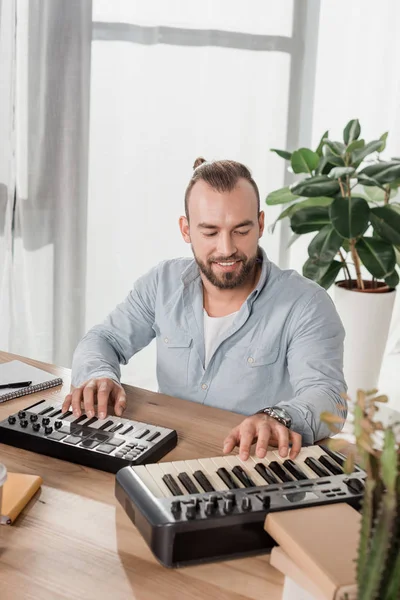 Sound producer working with mpc pads — Stock Photo