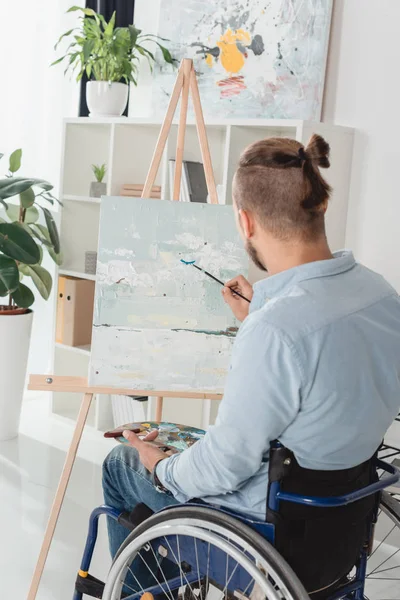 Disabled man painting — Stock Photo